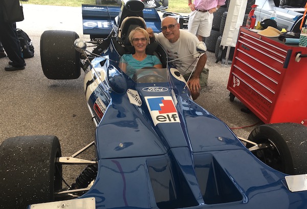 Larry and Roxane Bakerjian try out a Formula One race car.