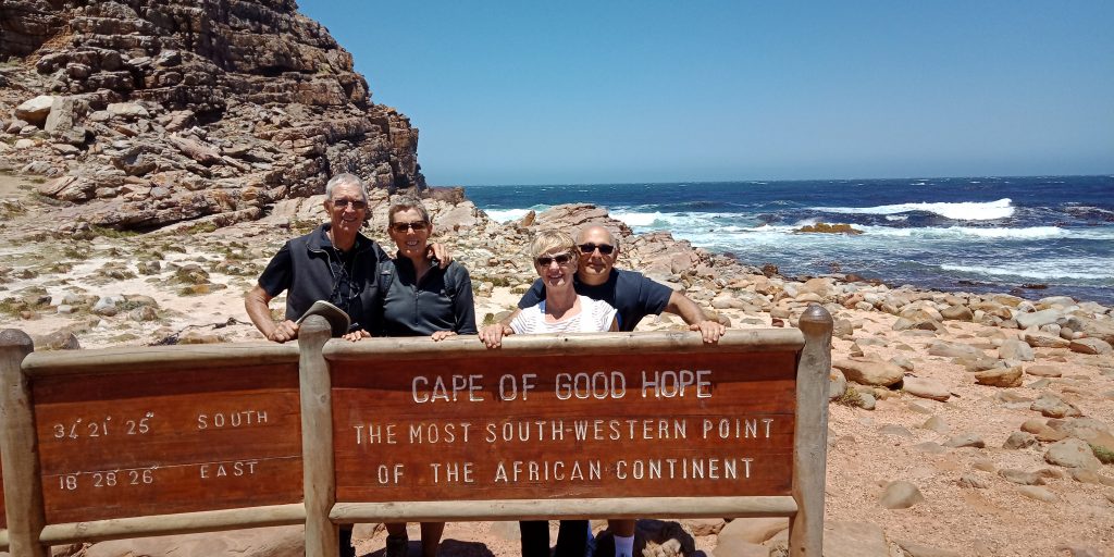 Jan and Rich (left) pose with Rox and Larry Bakerjian near Cape Town, South Africa, in 2018.