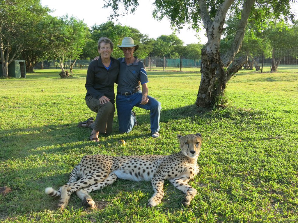 Jan and Rich with a cheetah at the Zululand Cat Conservation Project in South Africa.